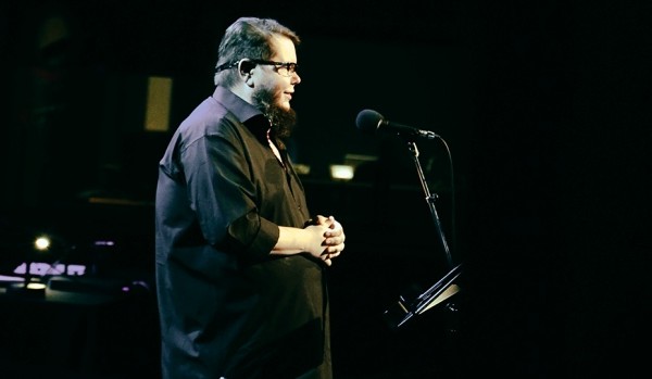 Shane Koyczan performing.